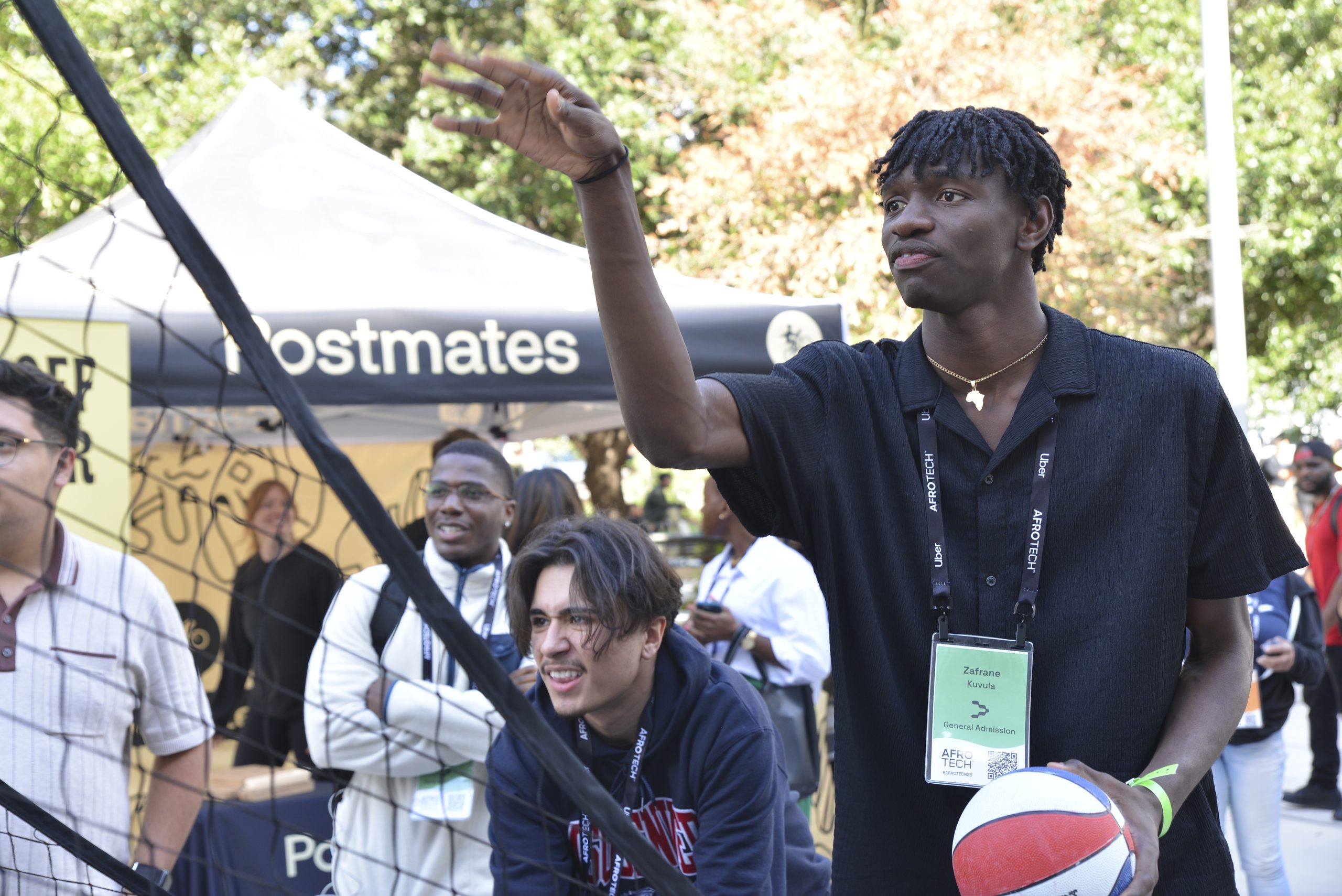 An AfroTech attendee engaging with a sponsor's branded activation