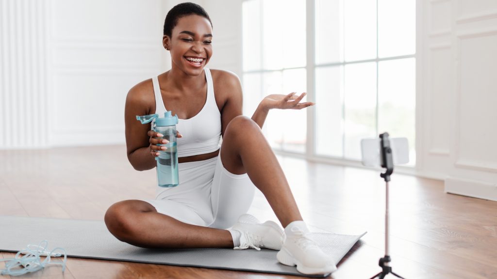 Black millennial woman creating user-generated content