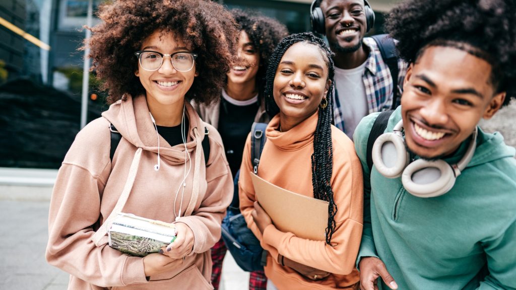 A group of African American college students enjoying their time together via audience building.