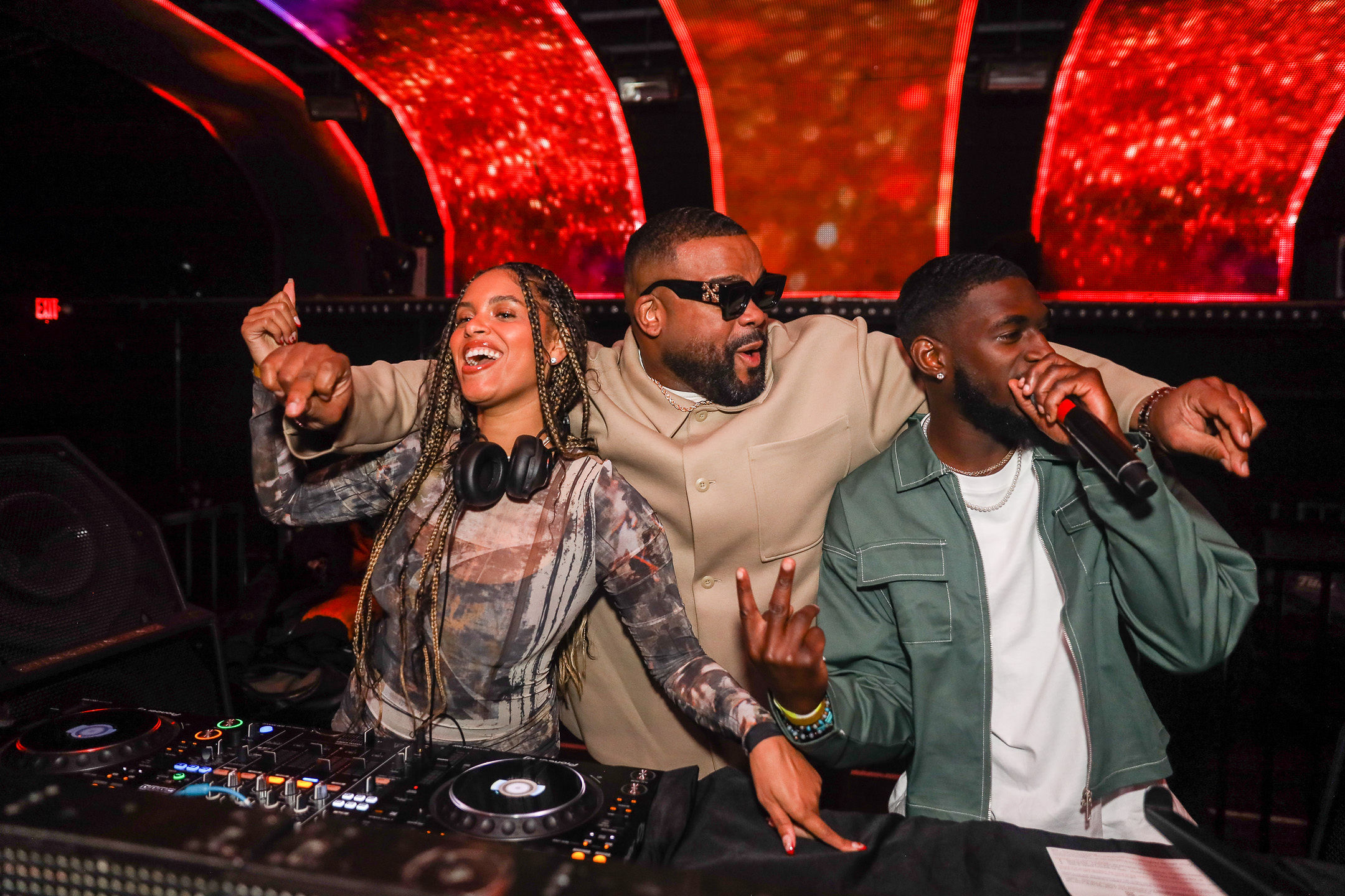 Blavity Grammy Party DJ and hosts partying together behind a DJ booth