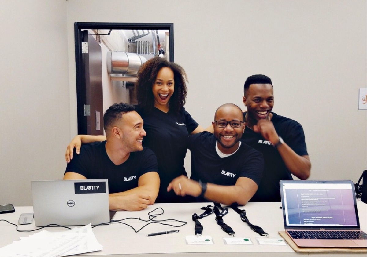 Blavity's 4 founders celebrating together during the early days of the company